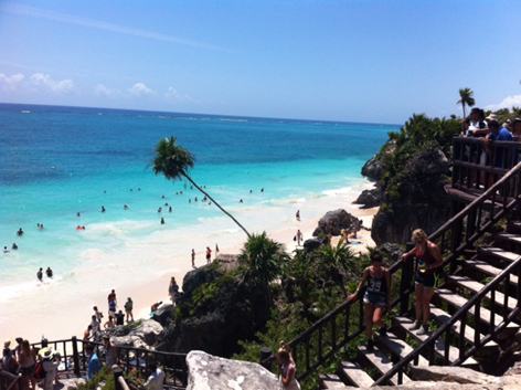 Swimmers at Tulum's Mayan ruins, Mexico