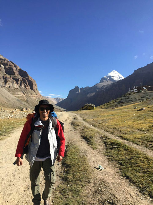 A young tour guide hiking in Tibet.