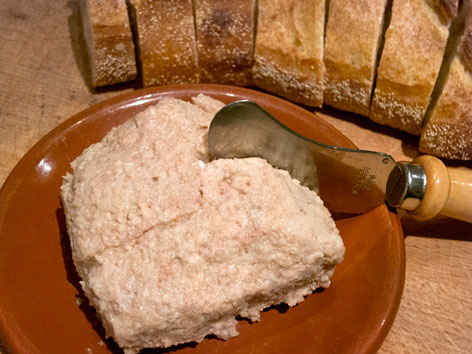 A spread of pork cretons and bread, from Montreal, Quebec