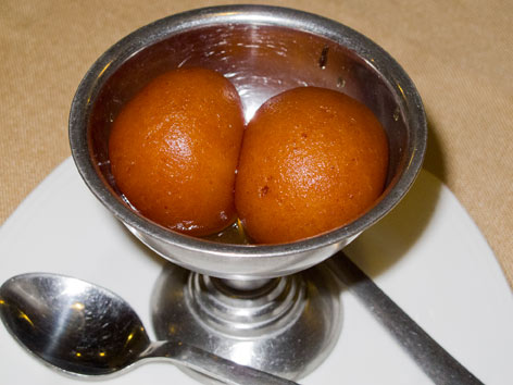 Two pieces of gulab jamun from Pindi in Delhi, India.