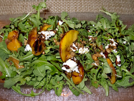 Argula salad with local peaches, tomatoes, and goat cheese from Rezaz in Asheville, North Carolina.