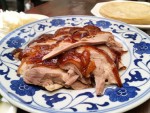 A plate of Peking duck with pancakes from an iconic Beijing restaurant. 