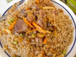 A plate of ceebu yapp, or rice and lamb, from a rice shack in Dakar, Senegal